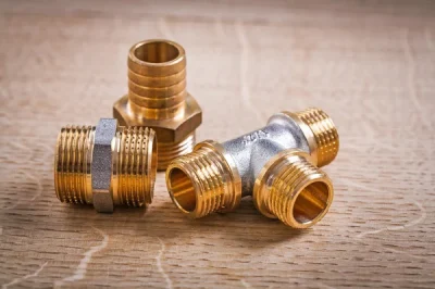 depositphotos_71281387-stock-photo-brass-pipe-connectors-on-wooden